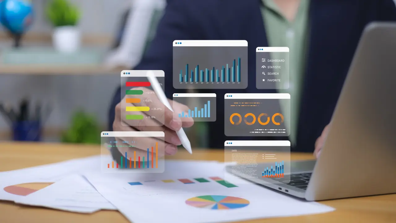 Human uses pen interacting with digital business analytics and reports. Symbolizes data visualization, financial performance, strategic decision-making. Corporate analysis, market trends, growth now.